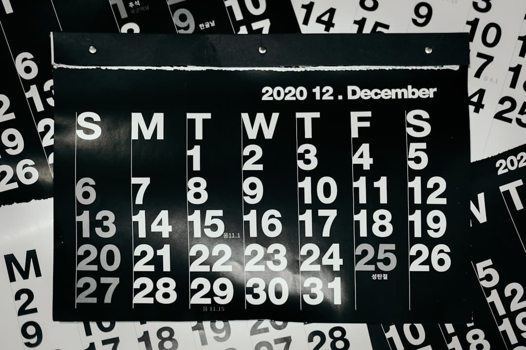 A wall calendar marked with weekly dose dates